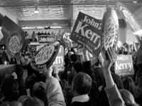 Photo: People holding up Kerry signs